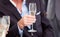 Businessman holding a glass of Champagne