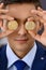 Businessman holding golden bitcoin and smiling. Virtual anonymous money concept, success in digital finance