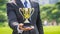 businessman holding a golden trophy