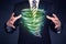 Businessman holding green tornado