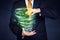 Businessman holding green tornado