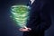 Businessman holding green tornado