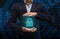 Businessman holding hologram of padlock protect icon in open palm