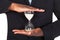 Businessman holding hourglass