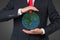 Businessman holding media icon in form earth