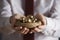 Businessman Holding Nest Full Of Golden Eggs