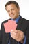 Businessman Holding Playing Cards