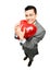 Businessman holding red heart balloon