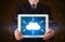 Businessman holding tablet with cloud icon