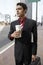 Businessman Holding Takeout Coffee Cup On City Street