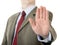 Businessman holding up stop palm hand gesture