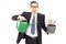 Businessman holding watering can and flowerpot with US dollars