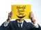 Businessman Holding World Smile Day Yellow Poster Covering His Face on White Background