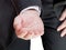 Businessman holds handful - hand gesture
