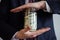 A businessman holds in his hands a bag full of money,savings, savings, dollars in a jar