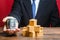 A businessman holds out a bundle of dollars near a pile of boxes. Trade and exchange goods, offers for cooperation. Profit