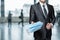 Businessman holds out a pack of protective masks on a blurred background