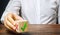 Businessman holds a wooden block with a green check mark. The concept of choice and making the right decision. Business management