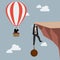 Businessman in hot air balloon fly pass businessman hold on the