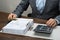 Businessman inspecting receipts in office