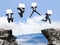 Businessman jumping with billboard on the mountain