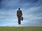 Businessman jumping in field