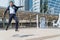 Businessman jumping with joy in success. Focus is on the left