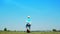 A businessman jumping slow motion and cloud sky background.