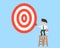 Businessman on ladder painting big target goal by paint brush, b