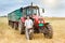 Businessman with laptop and tractor