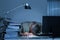 Businessman Leaning Head On Desk By Binders While Working Late