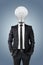 Businessman with light bulb head, creativity in business concept