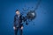 Businessman looking down, hands at sides, being destroyed in pieces by demolition ball.