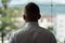 Businessman Looking Through Office Window