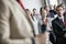 Businessman looking at public speaker in convention center