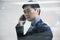 Businessman looking thorough window in parking garage, reflection of car