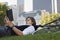 Businessman Lying Down On Bicycle While Reading Book