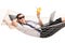 Businessman lying in hammock and drinking a cocktail