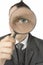 Businessman with magnifying glass