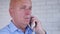 Businessman Make a Phone Call Using Office Landline