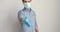 Businessman in medical mask protective gloves stretch arm for handshake