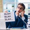 Businessman with message in the office at desk