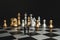 Businessman miniature handshake on chessboard with gold and silver chess background. Partnership concept.