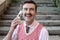 Businessman with a mustache using vintage walkie talkie