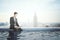 Businessman with notebook in rooftop pool