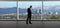 Businessman in an office looking at the view of downtown Los Angeles