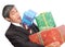 Businessman overwhelmed by presents