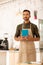 Businessman owning coffee shop wearing apron