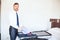 Businessman packing his clothes before leaving