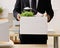 Businessman packing personal desk items in box